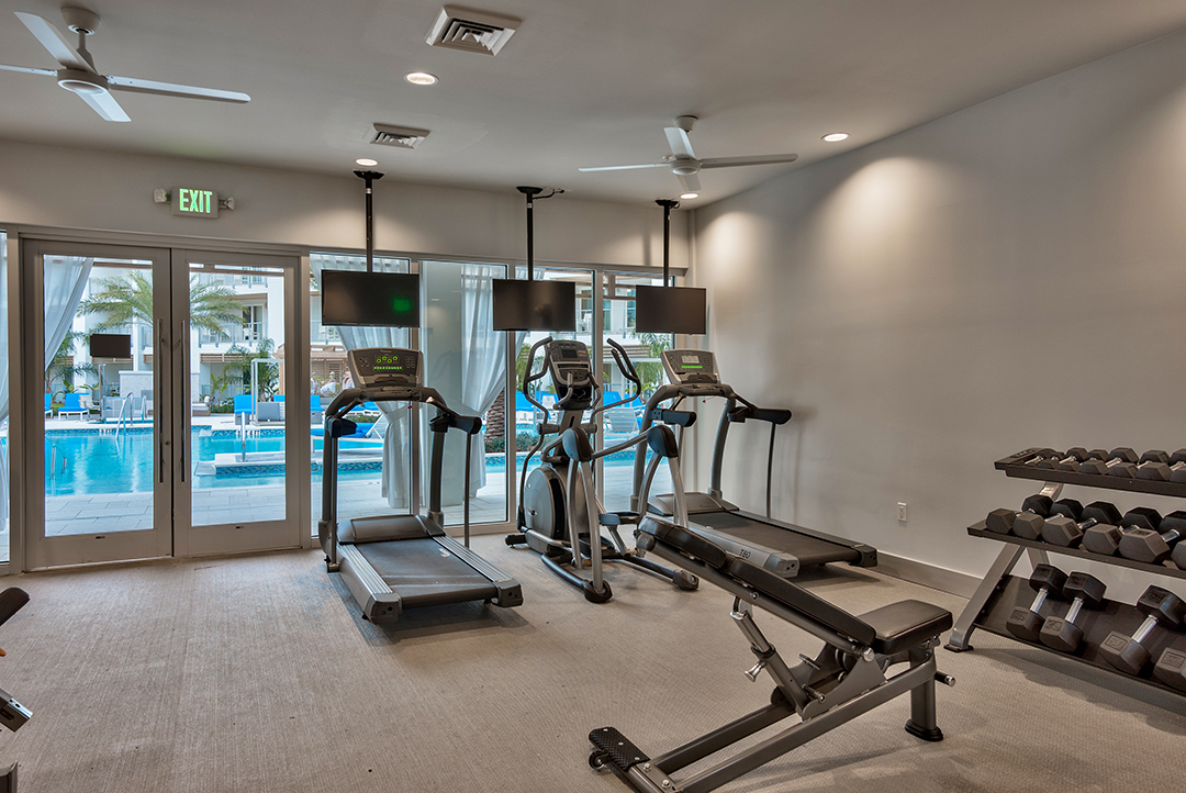 multifamily-fitness-center-interior-design-trends-pool-view multifamily-fitness-center-interior-design-trends-pool-view